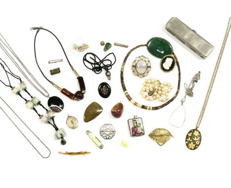 A collection of costume jewellery, to include a back and front oval locket, with engraved decoration of a bird with a basket 