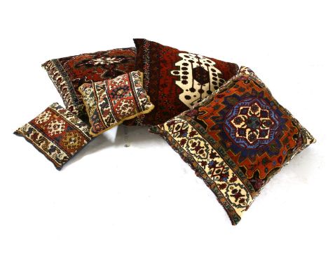 Three large carpet cushions and two smaller, largest 90 x 69cm
