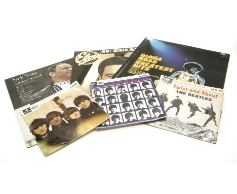 A collection of rock memorabilia, to include Elvis Presley, The Beatles, 45rpm records