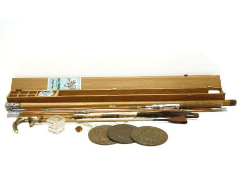 A Japanese fly fishing rod, by Ebisu, together with a white metal topped walking case, two riding crops, three death pennies,