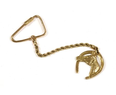 An Egyptian gold keyring with rope chain, horseshoe and head medallion pendant, Egyptian hallmarks, tested as approximately 1