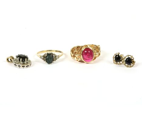 A 9ct gold single stone synthetic ruby cabochon ring, with textured head, 5.56g, size Q½, a 9ct gold topaz and white stone cl