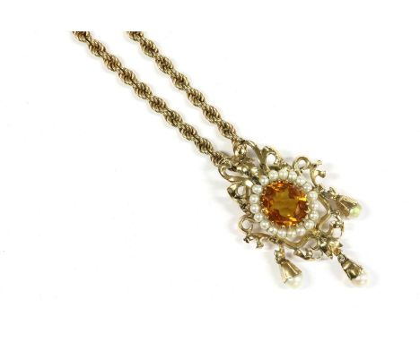 A gold single stone citrine and cultured pearl brooch/pendant, suspended on a 9ct gold rope chain, pendant tests as approxima