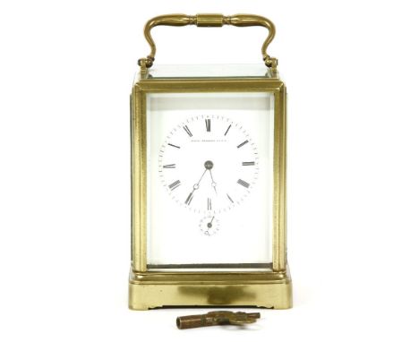 A French brass carriage clock with alarm mechanism, by Japy Freres, the white enamel dial inscribed 'Brevet d'invention SCDG'