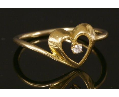 A gold single stone diamond 'Loving Heart' ring by Tiffany, with an open heart frame and a brilliant cut diamond, four claw s