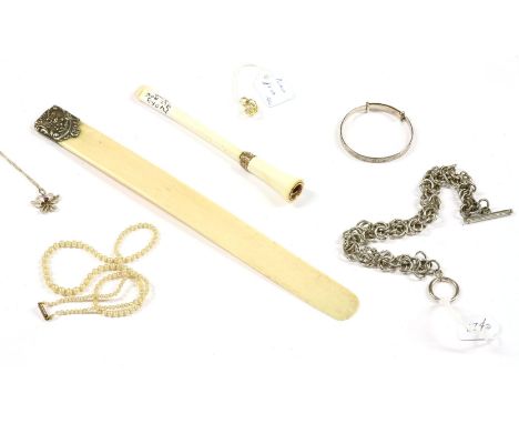 A collection of costume jewellery, to include an ivorine cigarette holder, with gold case decoration, an ivory and silver pag