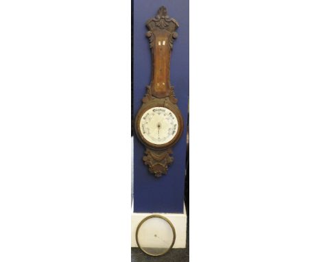 A George III inlaid mahogany barometer, with silvered dial by Ruontos, together with an early 20th century carved oak aneroid