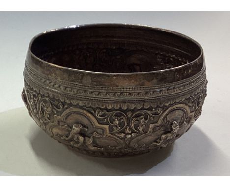 A Burmese silver panelled bowl chased with figures. Approx. 95 grams. Est. £80 - £120.