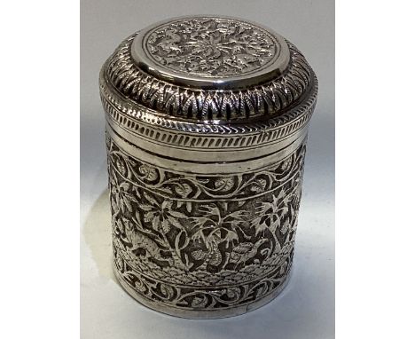 A heavy chased Indian silver tea caddy with lift-off cover. Approx. 124 grams. Est. £50 - £80.