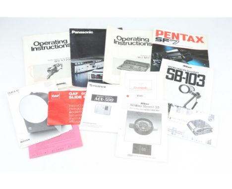 including a Pentax SF7 brochure, a Nikon W-Nikkor 35mm f/2.5 manual, and many more,
