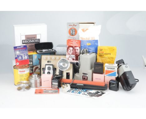 including a Kodak Brownie Starflex outfit, a selection of light meters, a projector, and more,