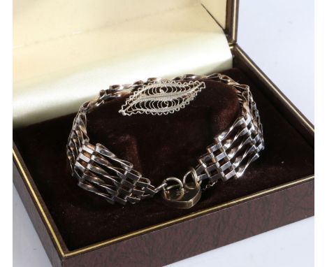 Silver gate link bracelet with a heart shaped lock together with white metal filigree brooch in the form of a leaf, gross wei