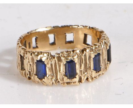 A 9 carat gold and sapphire bark effect ring, set with five baguette cut sapphires, weight 3.4 grams 