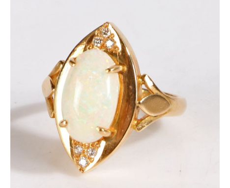 White opal diamond and yellow metal ring, set with a large claw mounted white opal together with six diamonds, with foreign m