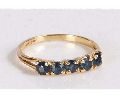 14 carat gold and sapphire ring, the head set with five claw mounted round cut sapphires, weight 1.6 grams&nbsp;