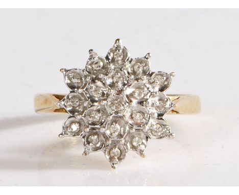 9 carat gold and diamond cluster ring, the head in the form of a flower set with many illusion set diamonds, weight 3.9 grams
