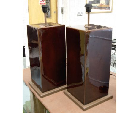 TABLE LAMPS, a pair, Julian Chichester style ceramic in burgundy glaze of rectangular form, raised on bases, 65cm H. (2)