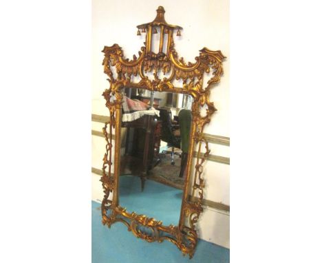 WALL MIRROR, Chinese Chippendale style giltwood with a pagoda and bell surmount and 'C' scroll decoration, 81cm W x 156cm H. 