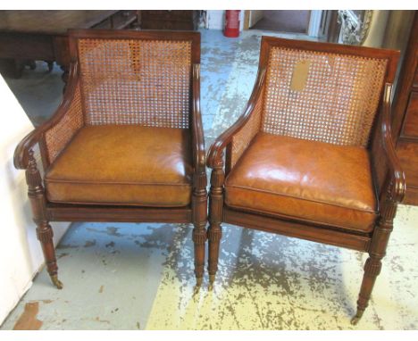 LIBRARY BERGERES, a pair, Regency style mahogany from Jonathan Charles with caned frames and brown leather cushion seats, 61c