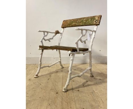 A Cast iron garden seat, white painted ends of naturalistic form (A/F) H86cm, W66cm, D50cm