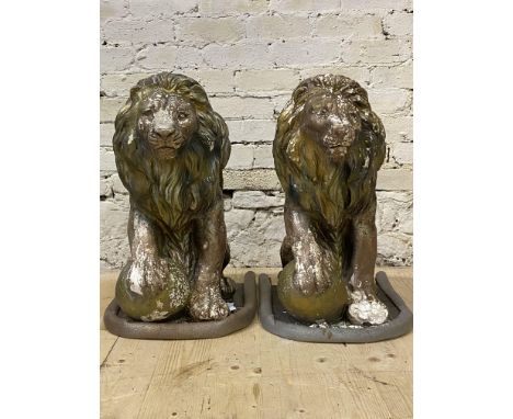 A pair of cast composition garden lions, each modeled in a seated position H65cm