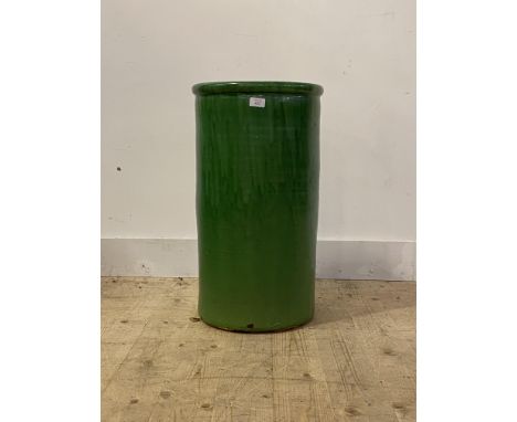 A Green glazed ceramic stick stand of compressed cylindrical form, H65cm, W35cm D30cm