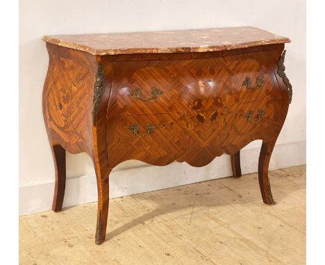A French kingwood and walnut bombe commode of serpentine outline, the rouge conglomerate marble top over marquetry to two dra