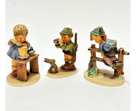 A Hummel pottery figure A Fair Measure, a boy decorated with polychrome enamels, (15cm x 9cm x 9.5cm), a Hummel pottery figur