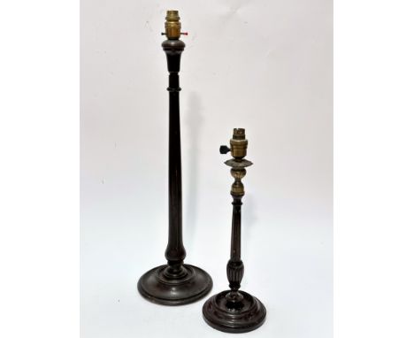 An Edwardian mahogany brass mounted Georgian style candlestick with fluted tapered column and circular moulded base, mounted 