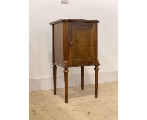 A French Empire style walnut night commode or bedside cupboard, early 20th century, single panelled door enclosing a shelf, c