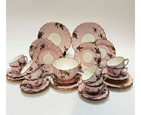 A Victorian china pink ground tea service of thirty seven pieces including two cake plates, (d 24cm) twelve side plates, (d 1