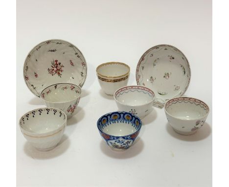 A pair of 19thc English china tea bowls decorated with hand painted floral sprays, with heart and dotted and blue border, wit