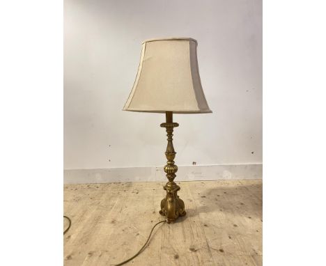 A gilt composition table light in the form of a candle stick, H72cm