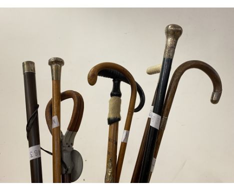 A Ceramic cylindrical stick stand, painted with floral design, (A/F) (H48cm) together with a collection of walking sticks, co