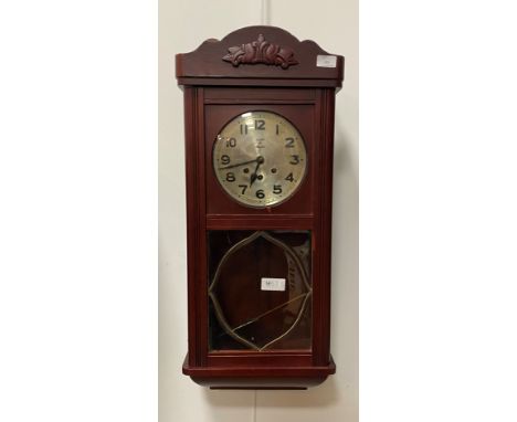 A 1930's Mauthe Westminster chiming wall clock, silvered dial with Arabic chapter ring, triple train spring movement, complet