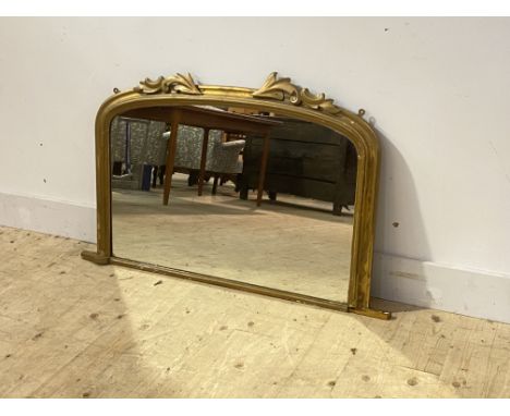 A Victorian overpainted gilt framed over mantel mirror, the arched top with carved acanthus leaf surmount 110cm x 68cm (losse