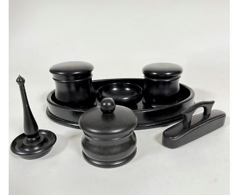 An Edwardian ebony seven piece dressing table set including two circular dishes with domed covers, (8cm x 7.5cm) an oval gall