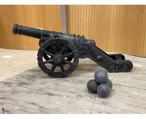 A cast iron garden model of a canon, L70cm