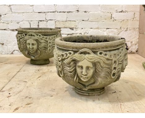 A pair of reconstituted stone garden planters of cylindrical form with Grecian imagery, D37cm