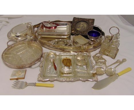 A quantity of silver plate to include a tea tray, condiments, entr‚e dishes and covers, a sugar sifter and flatware