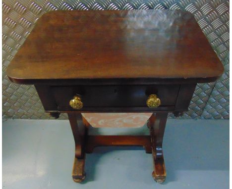 A rectangular mahogany sewing table, single drawer with brass handles on scrolling bracket supports, 72.5 x 55x 40.5cm