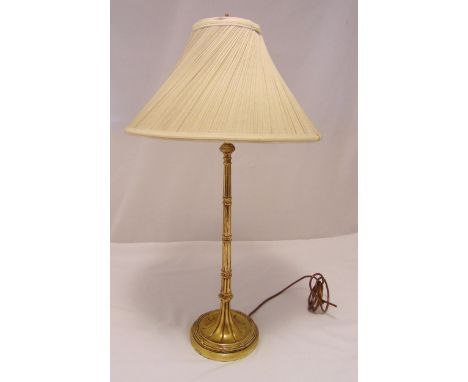 A gilded composition simulated bamboo stem table lamp, on raised circular base with reed and tie border and silk shade, 76cm 