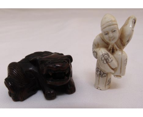 Two Netsuke carvings to include a figurine of a lady 4.5cm (h) and dog of foe 4.5cm (w)