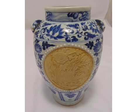 A Ming style blue and white baluster vase decorated with lotus leaves and ceramic panels with Kylin and Phoenix carved decora