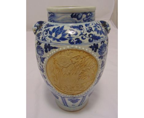 A Ming style blue and white baluster vase decorated with lotus leaves and ceramic panels with Kylin and Phoenix carved decora