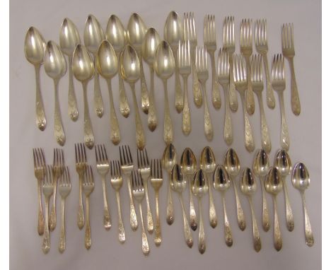 A quantity of George III Irish bright cut engraved hallmarked silver flatware, comprising twelve tablespoons Dublin 1804, twe