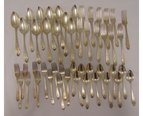 A quantity of George III Irish bright cut engraved hallmarked silver flatware, comprising twelve tablespoons Dublin 1804, twe