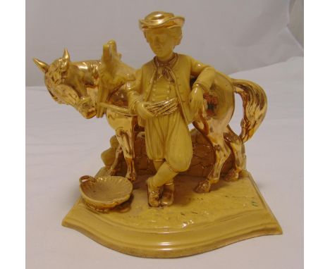 Eichwald porcelain pipe stand in the form of a boy with a horse, marks to the base, 17 x 19cm, A/F