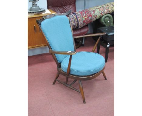 An Ercol Style Easy Chair, with spindle back and splayed legs.