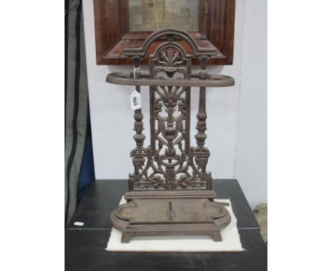 A XIX Century Style Cast Iron Stick/Umbrella Stand, with an arched top, pierced centre with vase decoration, cast iron drip t